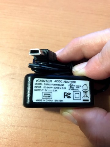 Power Adapter Input: 110V, Output: 6 V .3 A w/ mini USB plug